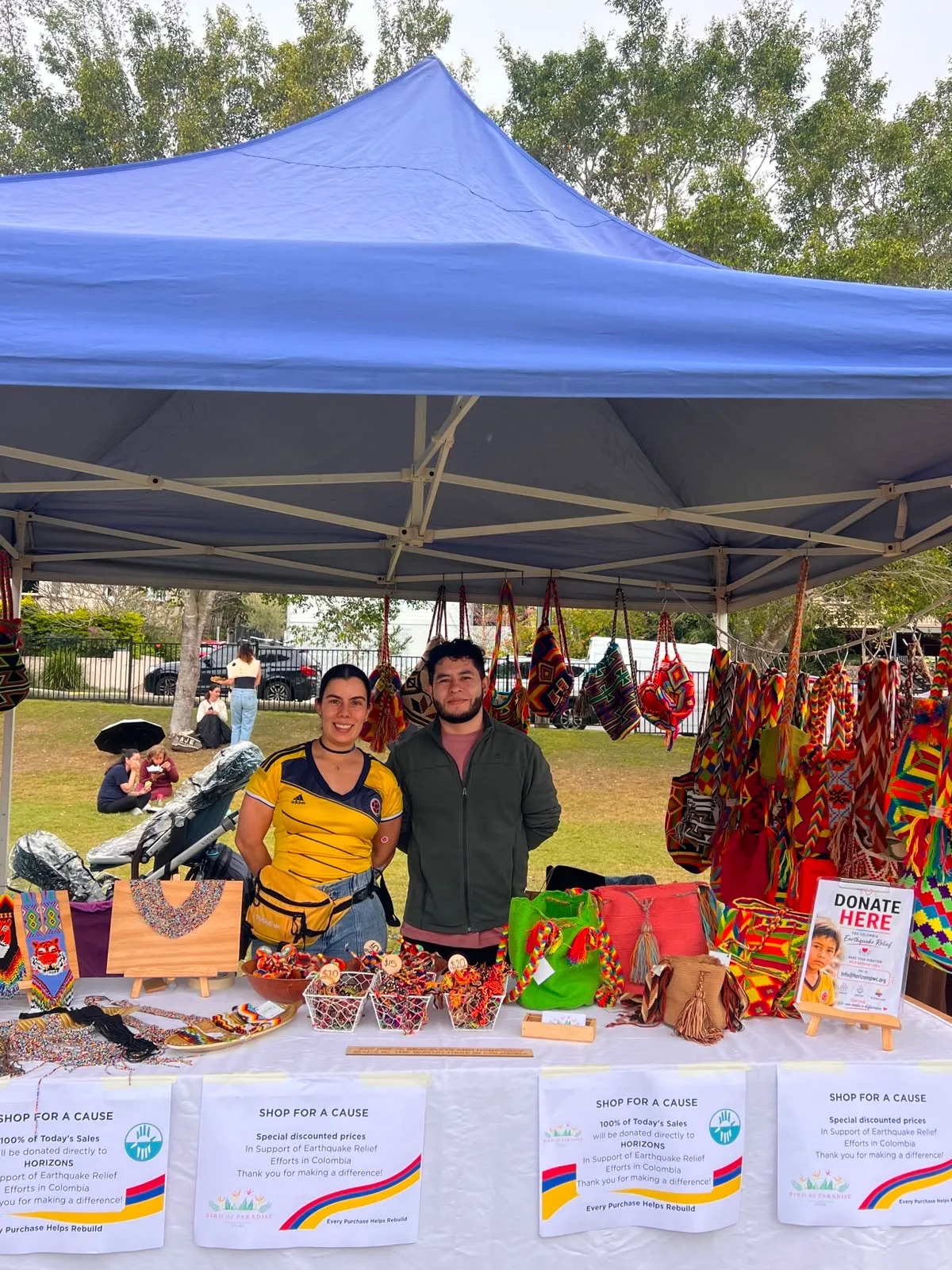 The Bird of Paradise stall at Lazos Latinos, covered in Wayuu bags and Shop for a Cause signs